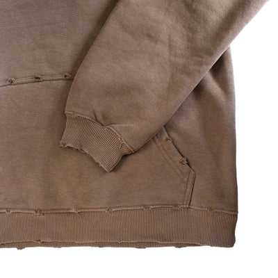 Brown sweatshirt with a focus on the sleeve and hem on a white background