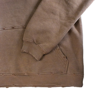 Brown sweatshirt with a focus on the sleeve and hem on a white background